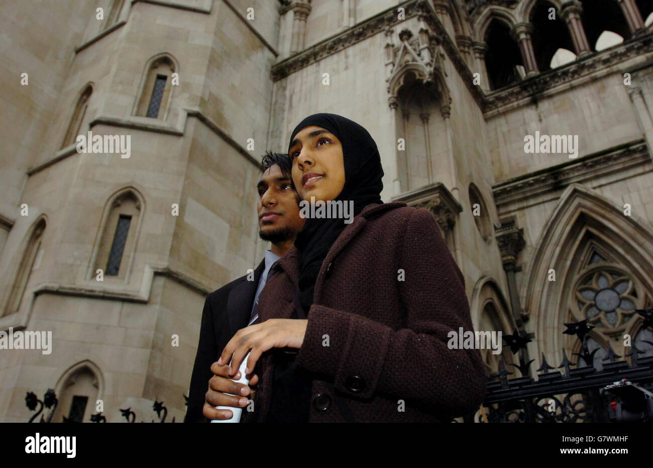 Shabina Begum, leaves the High Court, alongside her brother Shuweb Rahman. The Muslim girl today won her battle to wear traditional 'head-to-toe' dress in the classroom after the Court of Appeal ruled her school had acted unlawfully in barring her. Stock Photo
