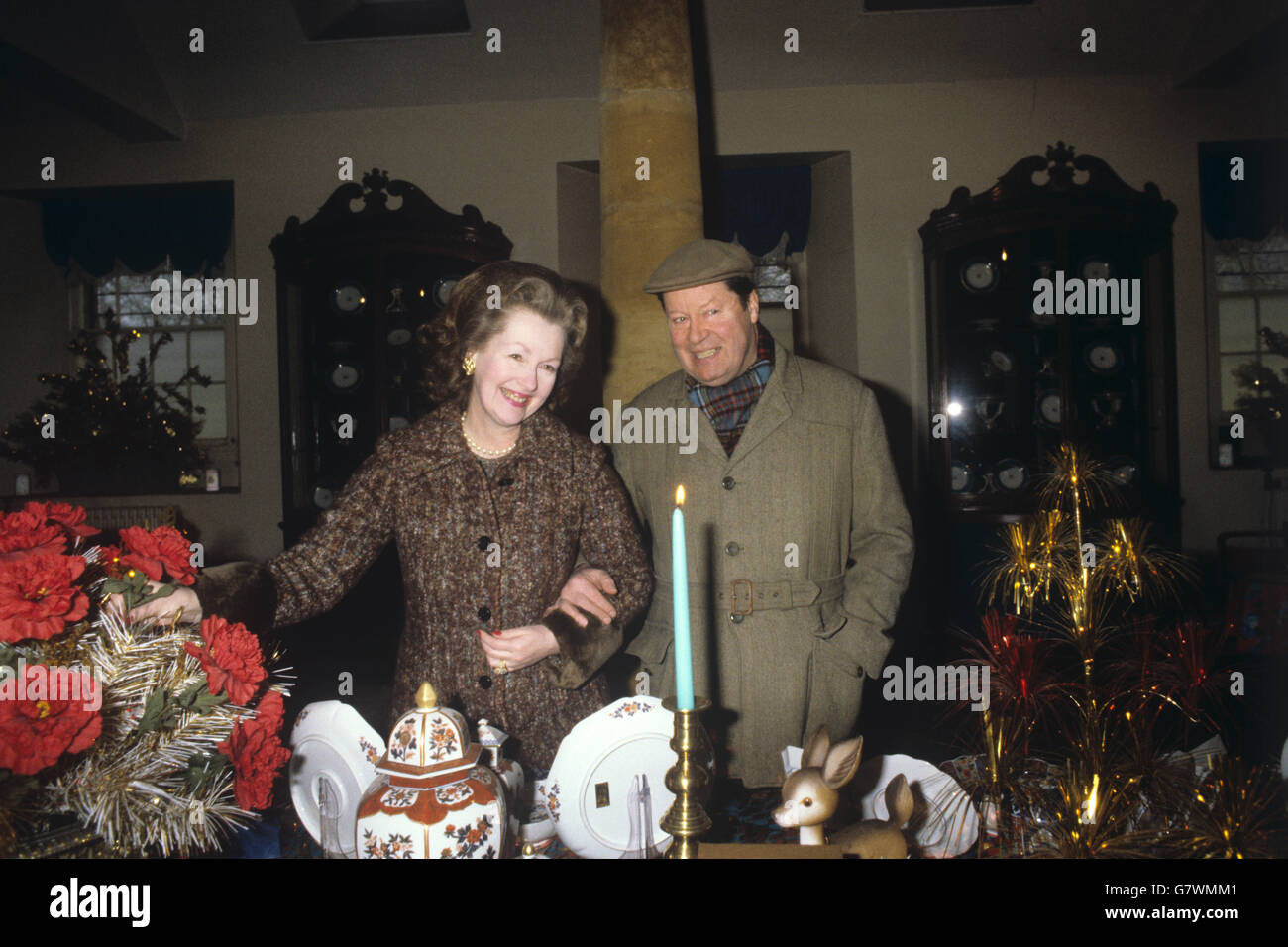 8th Earl Spencer, father of Princess Diana, with his wife, Raine Spencer, Countess Spencer, at their home at Althorp, Northamptonshire, which is open to the public. They are pictured here in the souvenir shop on the estate. Stock Photo