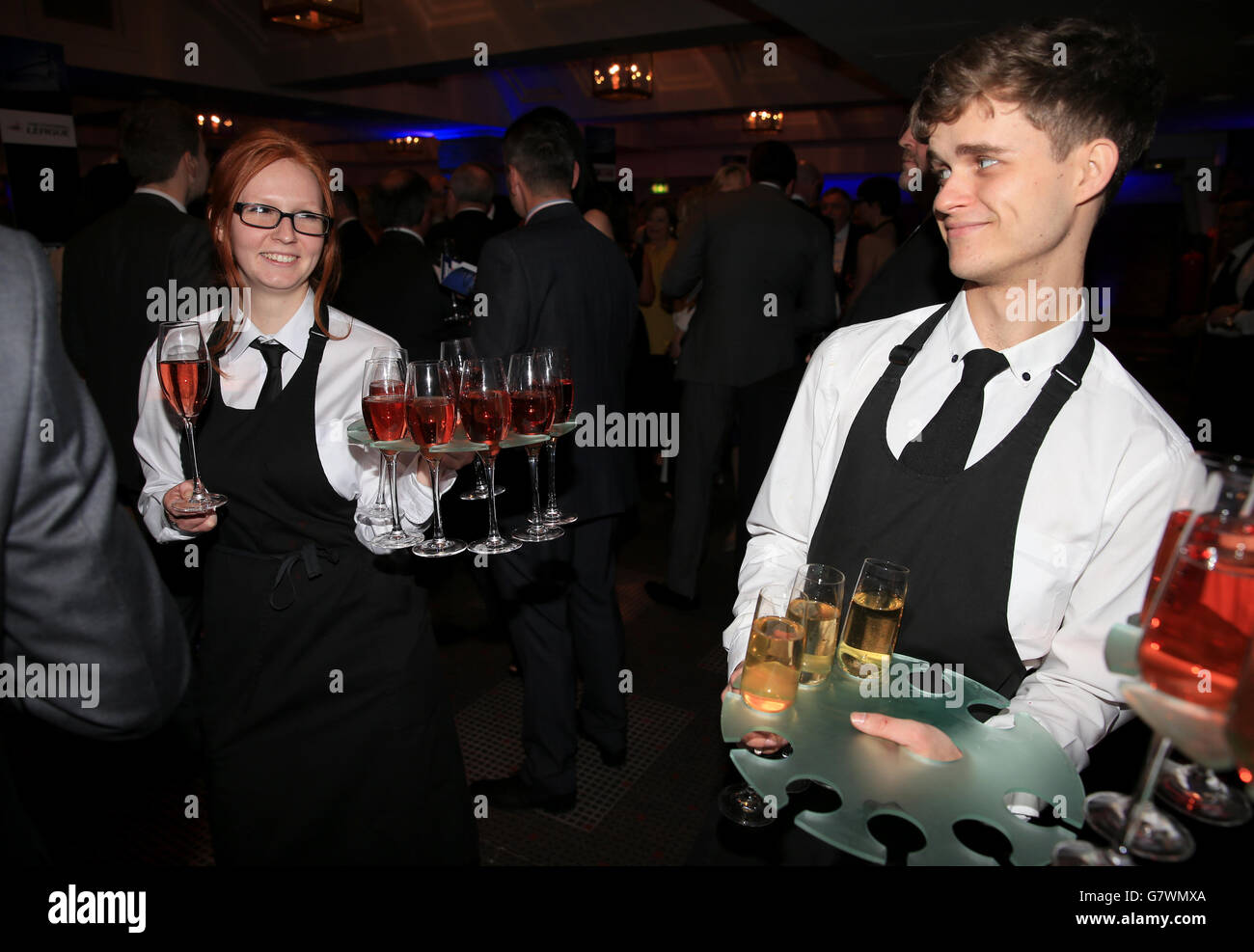 Staff offer drinks to guests during the Football League Awards 2015 at The Brewery in London. Stock Photo