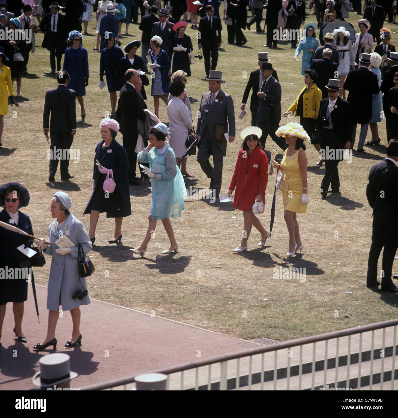 Horse Racing - Royal Ascot - Ascot Racecourse. Colourful dresses in the paddock area at Royal Ascot. Stock Photo