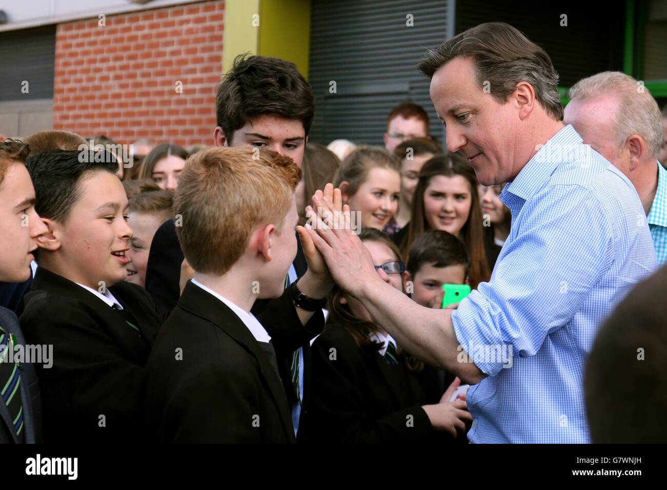 Prime Minister David Cameron meets pupils during a visit to Sandymoor ...