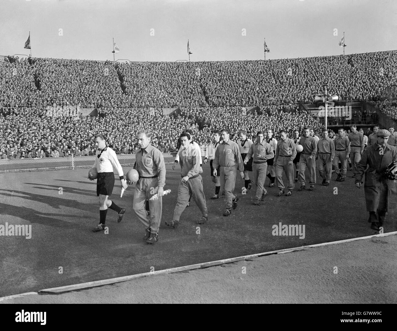 The two teams walk out at Wembley before the match, West Germany led by Jupp Posipal (l) and England by Billy Wright (second l). The other England players are (l-r) Ronnie Allen, Ron Staniforth, Len Shackleton, Stanley Matthews, Roy Bentley, Tom Finney, Len Phillips, Bill Slater, Bert Williams and Roger Byrne Stock Photo