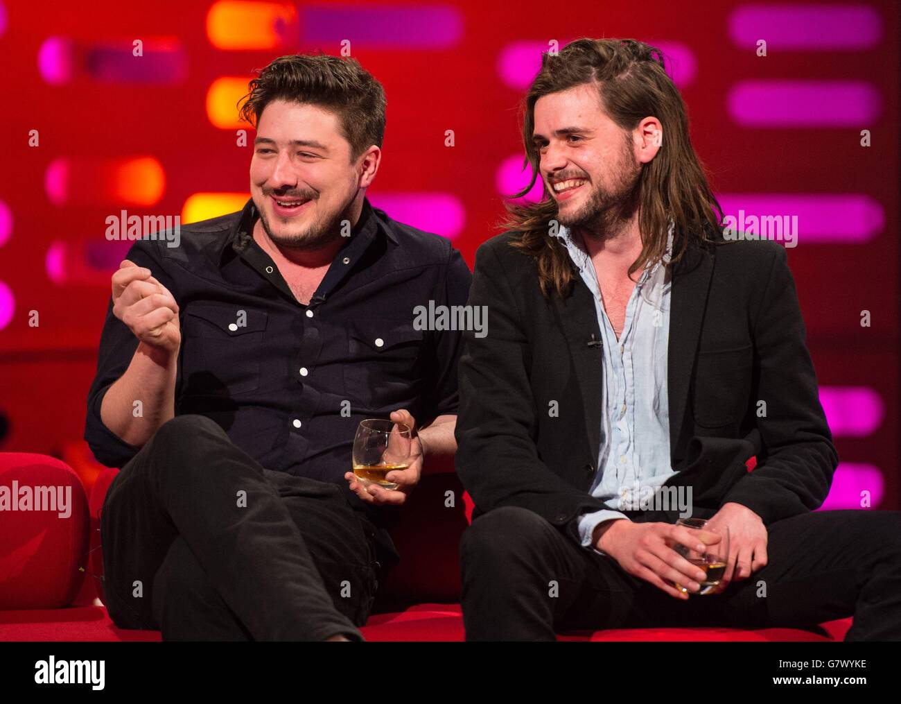 Marcus Mumford and Winston Marshall of Mumford and Sons during filming of the Graham Norton Show, at the London Studios, south London. Stock Photo