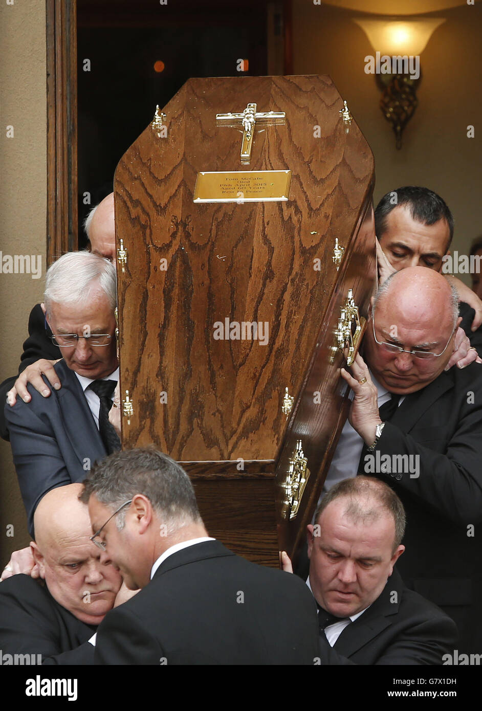 The coffin of former Labour MSP Tom McCabe is carried from St Mary's