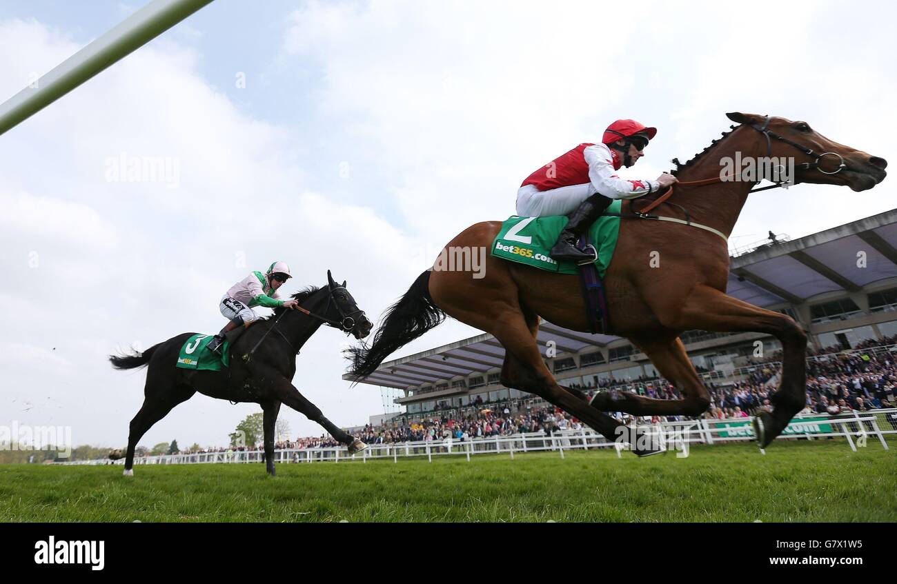 Custom Cut ridden by Daniel Tudhope on their way to victory in the bet365 Mile during bet365 Friday at Sandown Racecourse, Surrey. Stock Photo