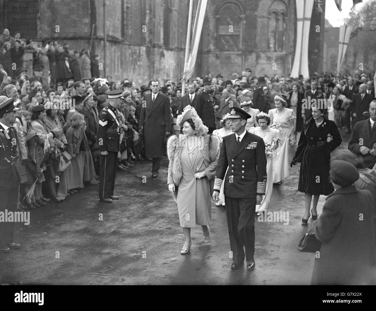 Three Royal Princesses were bridesmaids at the wedding of the Hon.Patricia Mountbatten to Captain the Lord Brabourne. Here, arriving at Romsey Abbey, are King George VI, Queen Elizabeth, Princess Elizabeth, Hon. Pamela Mountbatten, sister of the bride, Princess Alexandra of Kent and Princess Margaret. Stock Photo