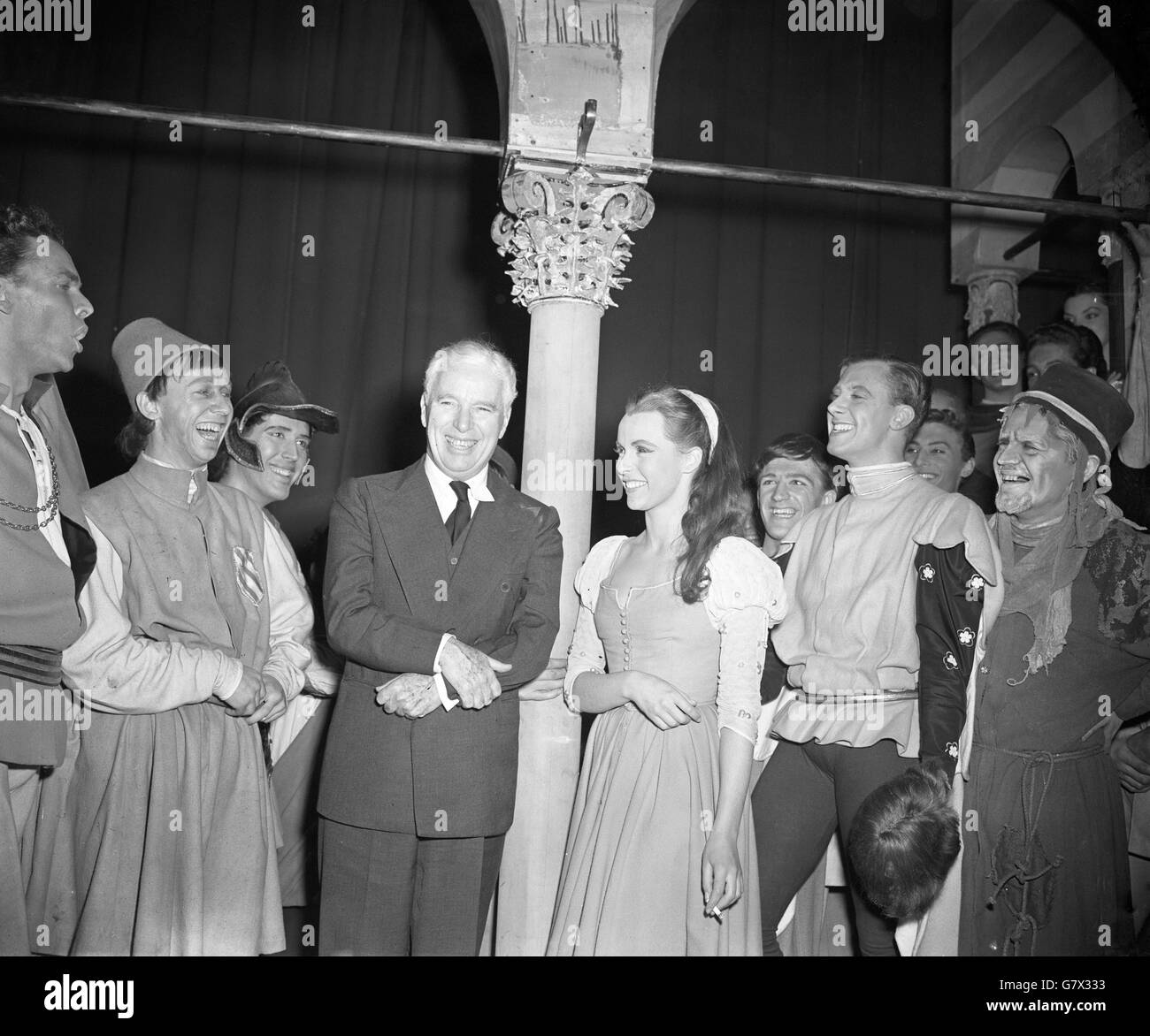 Pictured at London's Old Vic Theatre with members of the cast of 'Romeo and Juliet', is Charlie Chaplin, paying his second visit to the theatre in 50 years. With him is Claire Bloom, his leading lady in 'Limelight', who plays Juliet. On her left is Alan Badel as Romeo. Stock Photo
