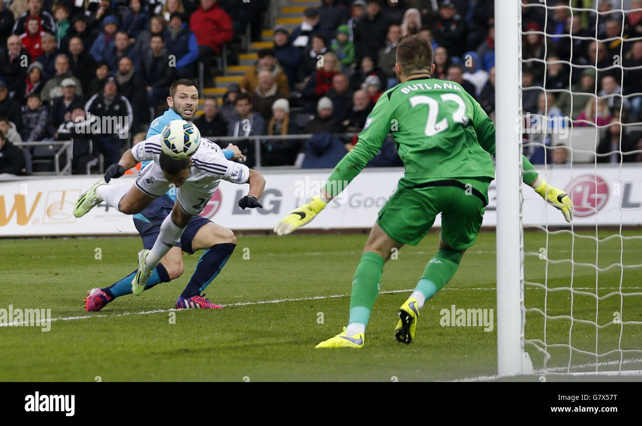 Swansea's Jefferson Montero scores during the Barclays Premier League match at the Liberty Stadium, Swansea. Stock Photo