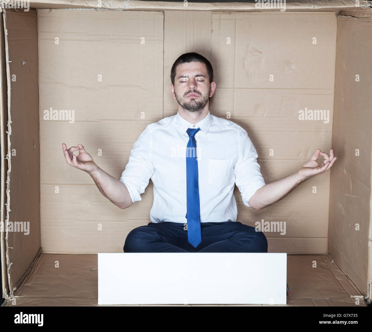 Handsome young man meditating hi-res stock photography and images - Alamy