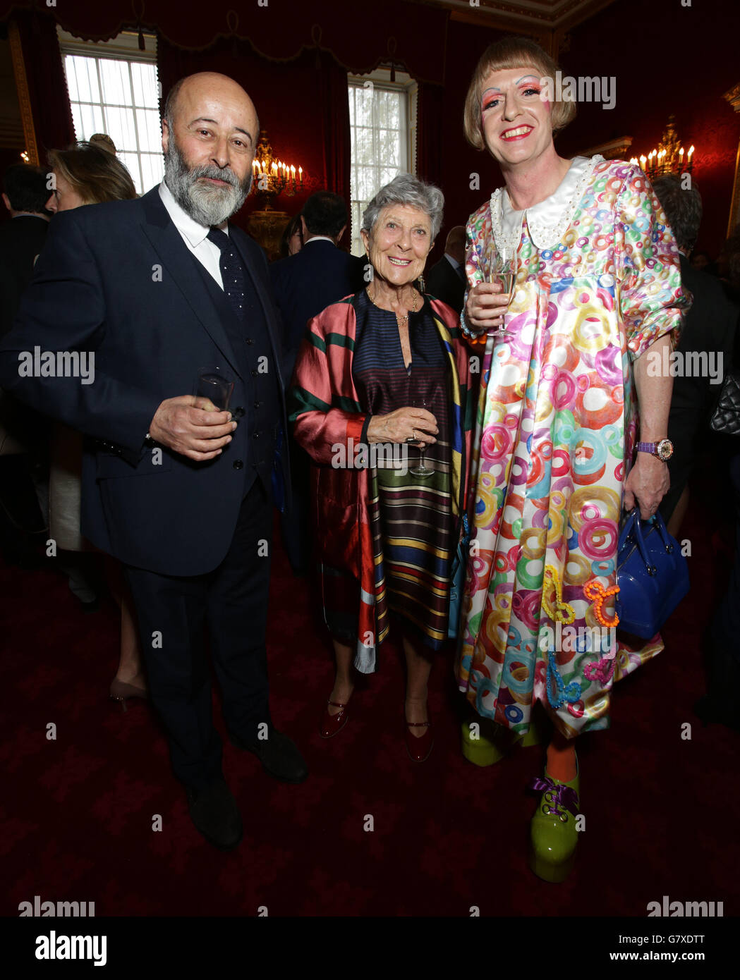 (left to right) Richard Young, Joan Burstein and Grayson Perry during a reception, hosted by The Countess of Wessex, for the London College of Fashion at St James's Palace, London. Stock Photo