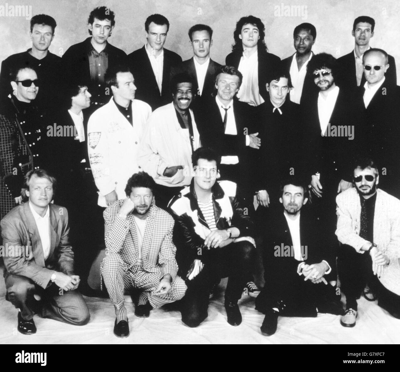 The pop stars who performed in the Prince's Trust Rock Gala at Wembley. Back row (l-r): Gary Kemp, Mark Brezicki, Peter Cox, Alan Murphy, Richard Drummie, Labi Siffre and Mike Lindup. Middle: Elton John, Leo Sayer, Midge Ure, Ben E King, Dave Edmunds, Jools Holland, Jeff Lynne and Ray Cooper. Front: Mark King, Eric Clapton, Tony Hadley, George Harrison and Ringo Starr. Stock Photo