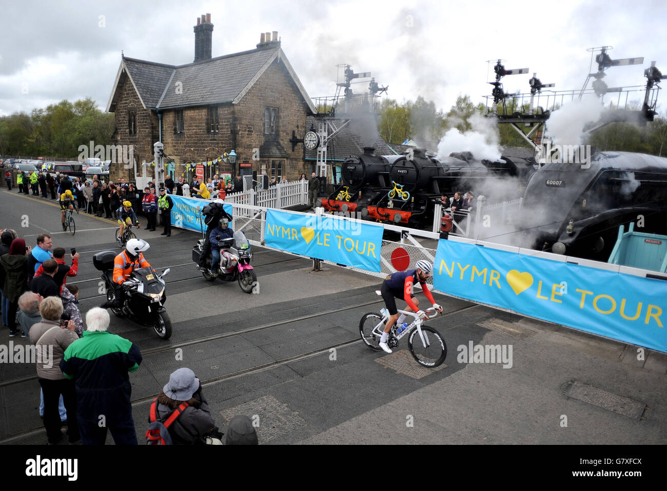 Sir Bradley Wiggins crosses the North Yorkshire Moors Railway line at Grosmont crossing during the Tour de Yorkshire between Bridlington and Scarborough. Stock Photo