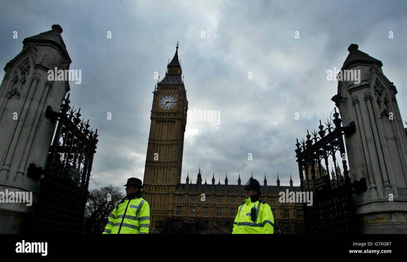 Police officers stand guard outside the house of Commons after an all ...