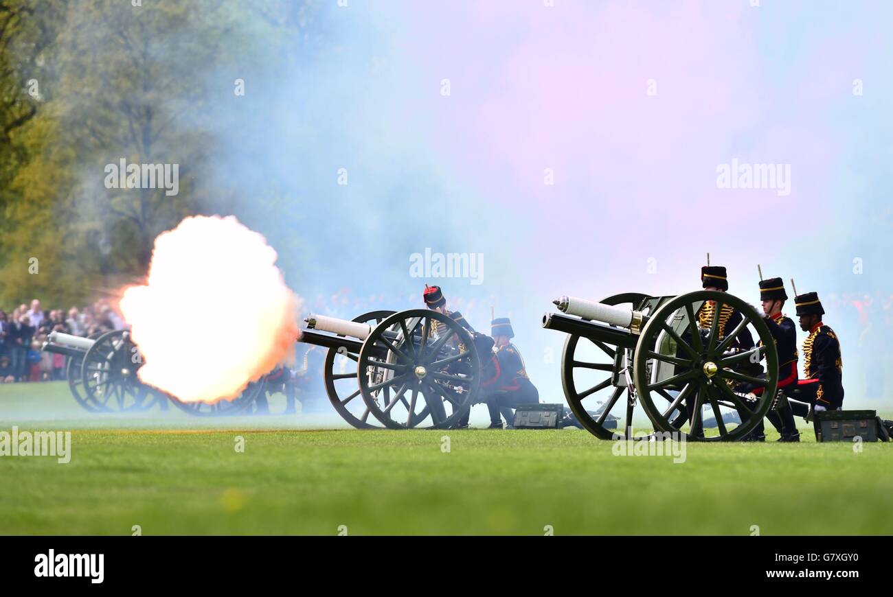 Members of the King's Troop Royal Horse Artillery fire a 41-gun royal salute marking the birth of the Duke and Duchess of Cambridge's baby princess, in Hyde Park, London. Stock Photo