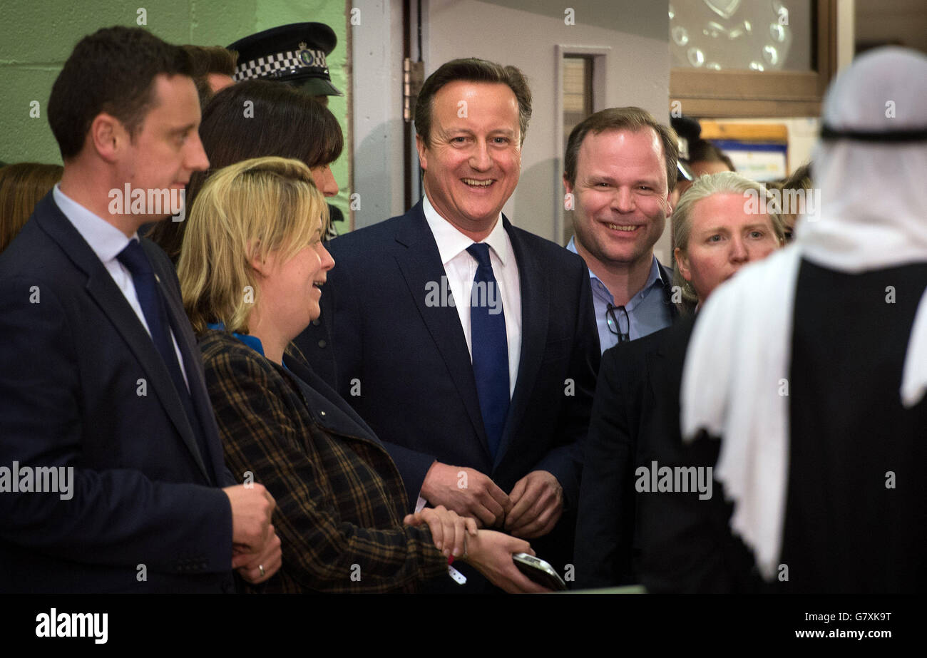 Prime Minister David Cameron with is team including Craig Oliver (right) share a joke before receiving his constituency result at the Windrush Leisure Centre in Witney. Stock Photo