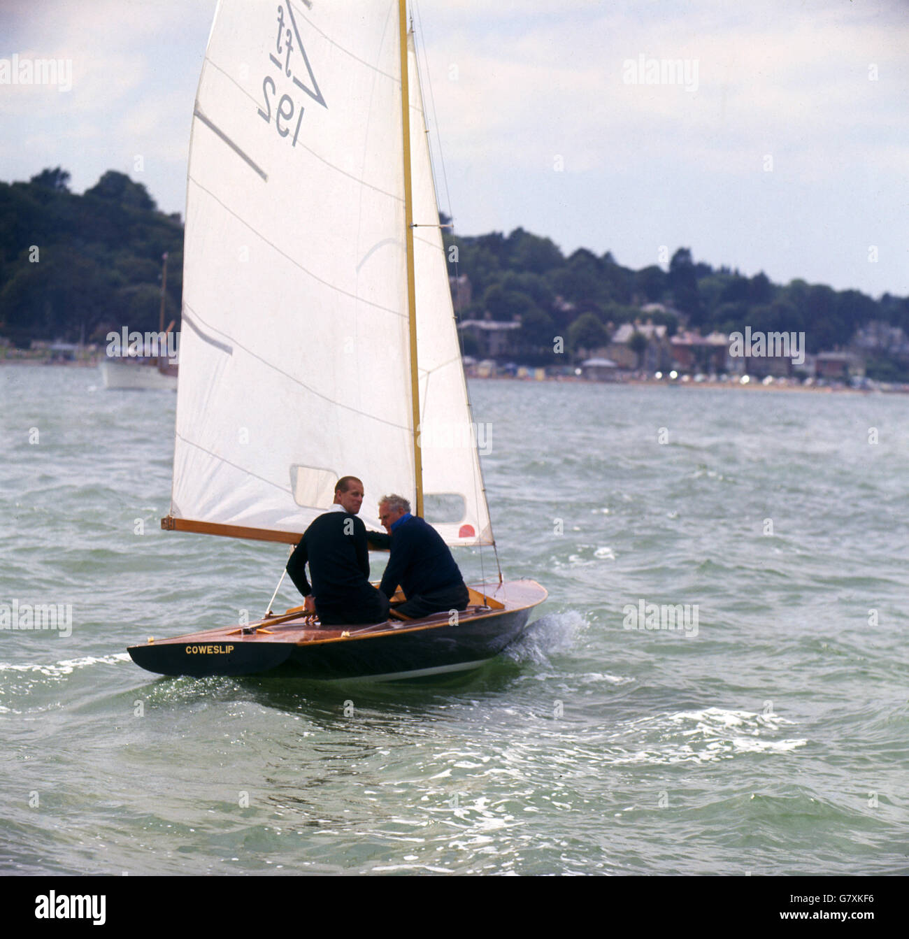 Prince Philip, The Duke of Edinburgh, sailing the 'Coweslip' at the Cowes Regatta, Isle of Wight. Stock Photo