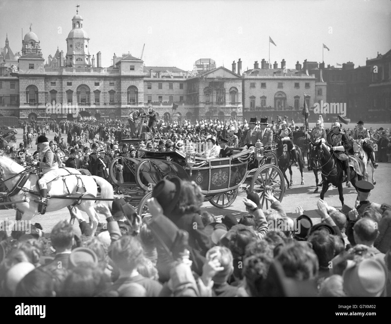 The King and Queen pass through Horse Guards Parade Ground during the State drive to St. Paul's Cathedral where a thanksgiving service will be held for their Silver Wedding Anniversary. Stock Photo