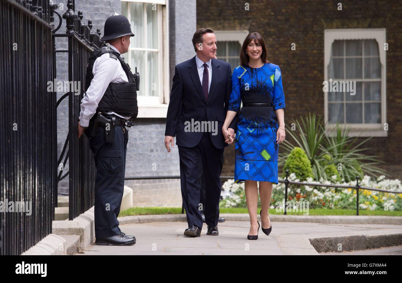 Prime Minister David Cameron and his wife Samantha arrive back at 10 Downing Street, following an audience with Queen Elizabeth II in Buckingham Palace to confirm his second term as Prime Minister after his party's General Election victory. PRESS ASSOCIATION Friday May 8 2015. See PA story ELECTION Main. Photo credit should read: Stefan Rousseau/PA Wire Stock Photo