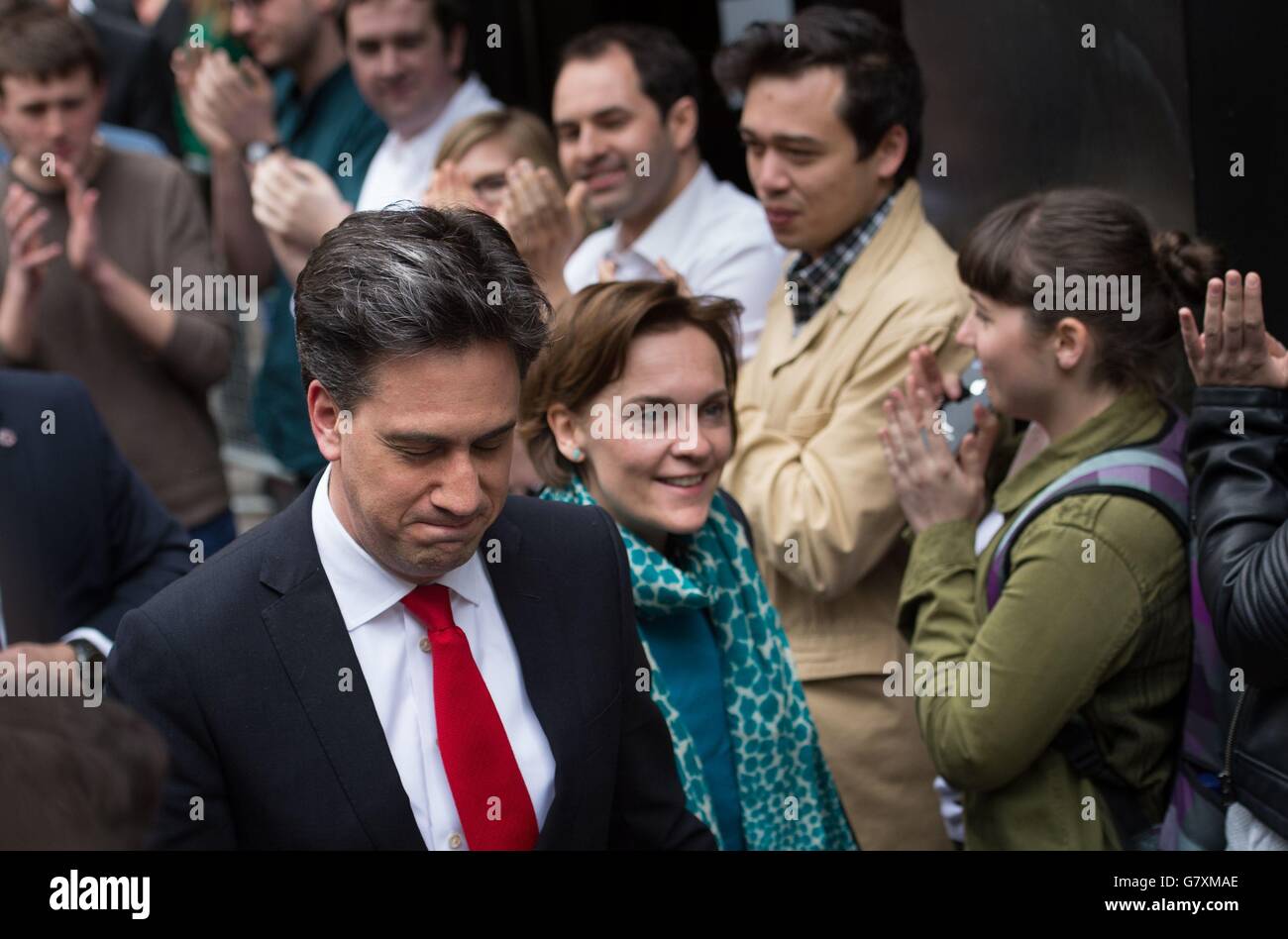 Labour leader Ed Miliband is greeted by staff as he arrives with his wife Justine at the Labour party central office in Brewer's Green, before delivering his resignation speech at 1 Great George street, London, following sweeping losses in Scotland and with David Cameron close to an overall majority. Stock Photo