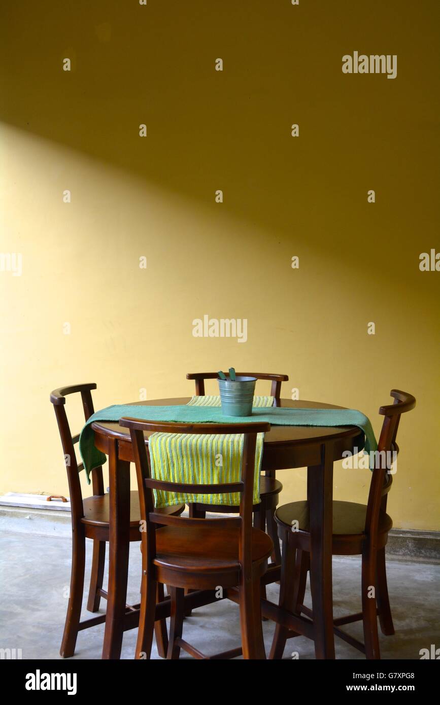 a table and four chairs in a cafe in Galle fort, Sri Lanka Stock Photo