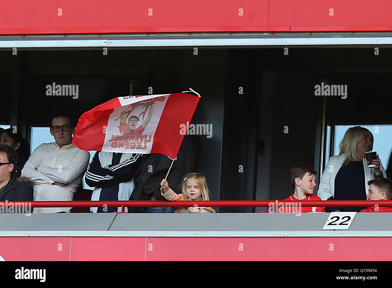 Liverpool's Steven Gerrard's daughter Lourdes Gerrard waves a flag from the stands during the Barclays Premier League match at Anfield, Liverpool. PRESS ASSOCIATION Photo. Picture date: Saturday May 16, 2015. See PA story SOCCER Liverpool. Photo credit should read: Peter Byrne/PA Wire. Editorial use only. Maximum 45 images during a match. No video emulation or promotion as 'live'. No use in games, competitions, merchandise, betting or single club/player services. No use with unofficial audio, video, data, fixtures or club/league logos.during the Barclays Premier League match at Anfield, Stock Photo