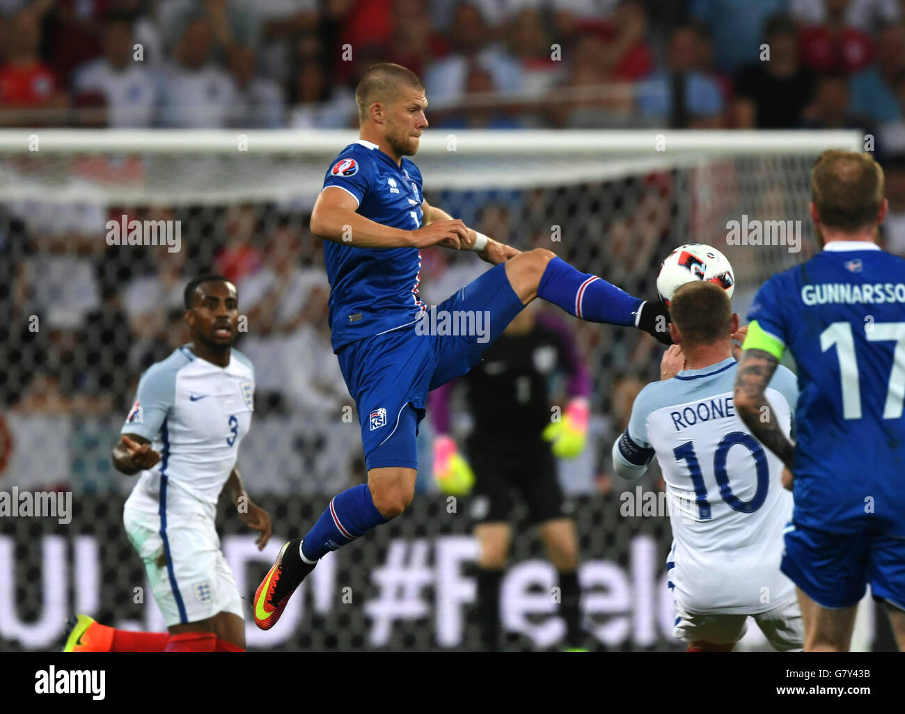 Nice, France. 27th June, 2016. Johann Gudmundsson(Top) of Iceland competes during the Euro 2016 round of 16 football match between England and Iceland in Nice, France, June 27, 2016. © Guo Yong/Xinhua/Alamy Live News Stock Photo