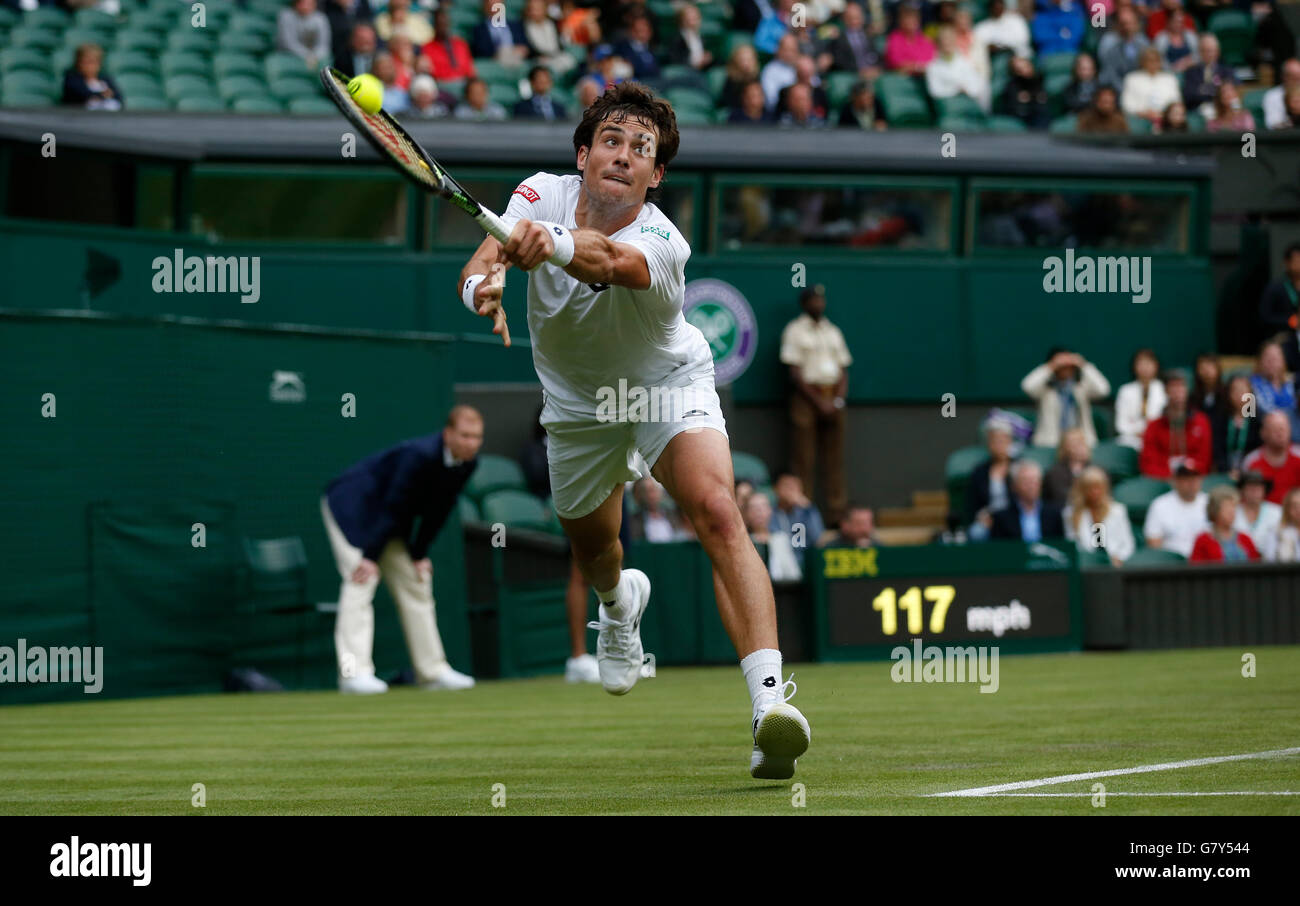 London, UK. 27th June, 2016. Guido Pella of Argentina returns the ball to Roger Federer of Switzerland during the men's singles first round match at the 2016 Wimbledon Tennis Championships in London, June 27, 2016. Guido Pella lost 0-3. © Ye Pingfan/Xinhua/Alamy Live News Stock Photo