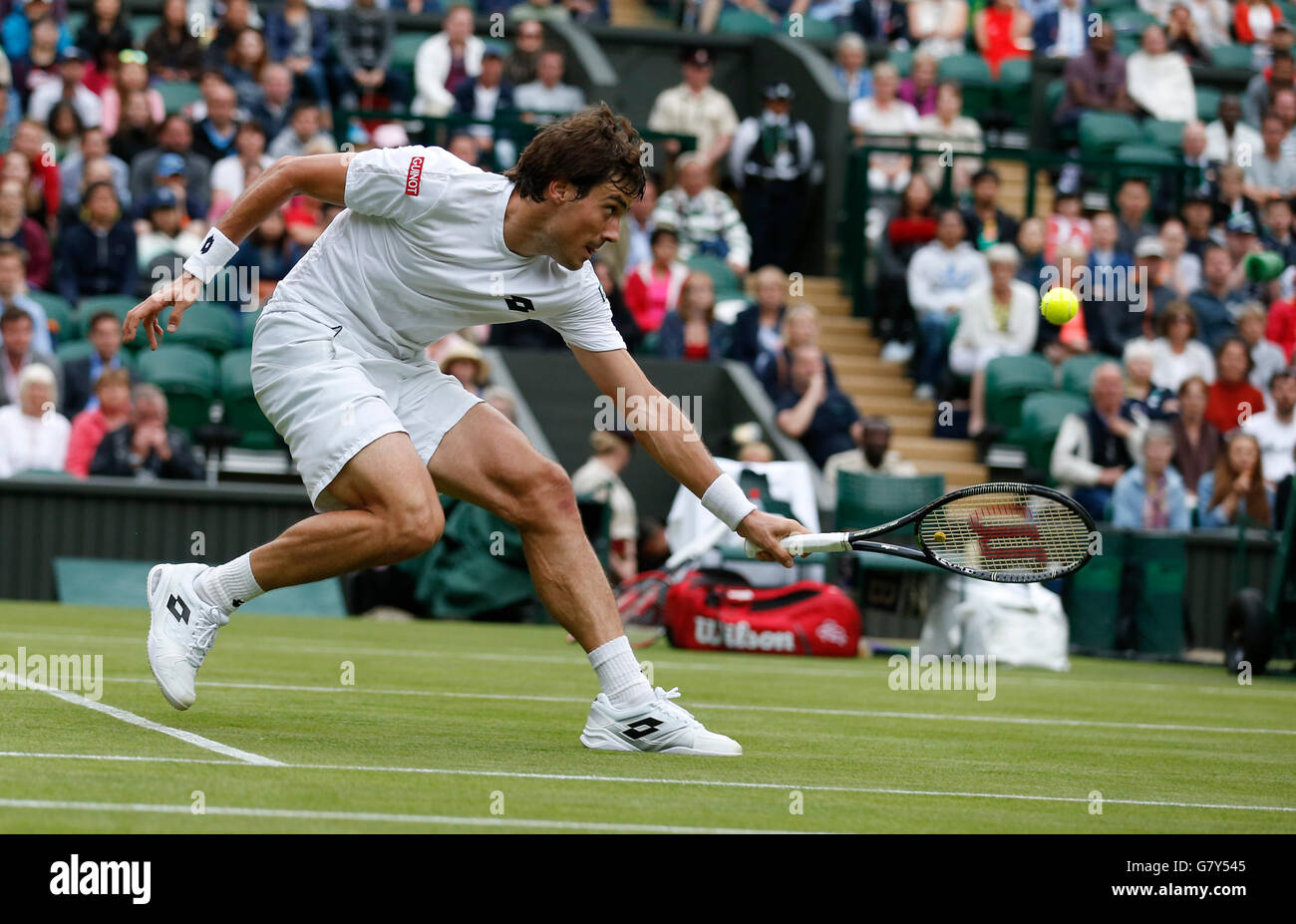London, UK. 27th June, 2016. Guido Pella of Argentina returns the ball to Roger Federer of Switzerland during the men's singles first round match at the 2016 Wimbledon Tennis Championships in London, June 27, 2016. Guido Pella lost 0-3. © Ye Pingfan/Xinhua/Alamy Live News Stock Photo