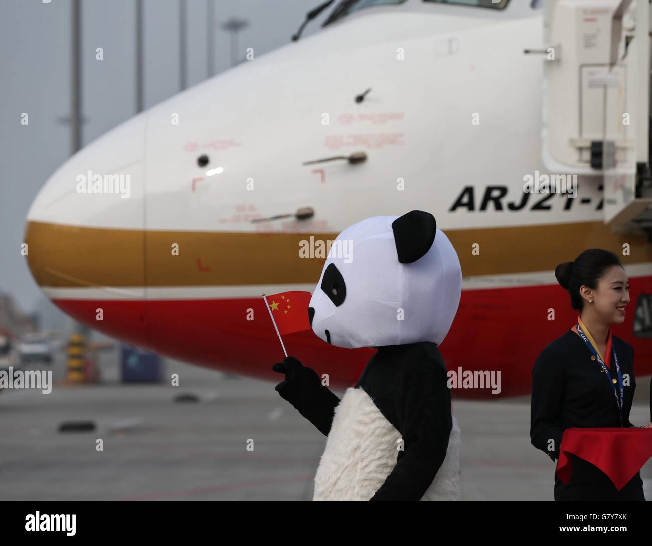 Chengdu, China's Sichuan Province. 28th June, 2016. A panda mascot is seen in front of Chengdu Airlines ARJ21-700 at Shuangliu International Airport in Chengdu, capital of southwest China's Sichuan Province, June 28, 2016. ARJ21, manufactured by the Commercial Aircraft Corp. of China (COMAC), made its maiden commercial flight from Chengdu to Shanghai Tuesday. The domestically-designed airliner is China's first regional jet manufactured according to international standards. © Ding Ting/Xinhua/Alamy Live News Stock Photo