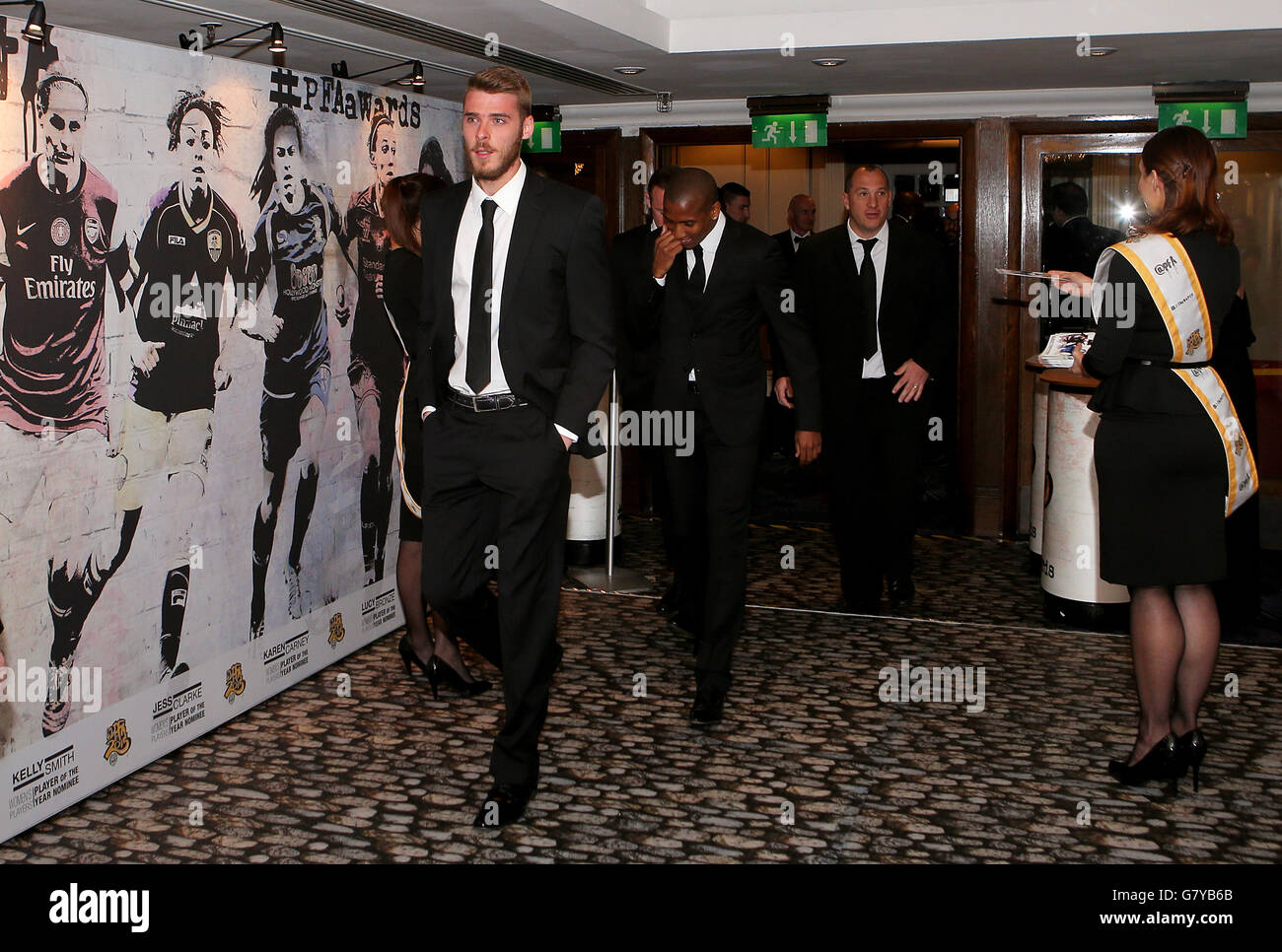 Manchester United's David De Gea (left) followed by teammate Ashley Young  during the PFA Player of the Year Awards 2015 at the Grosvenor House Hotel,  London Stock Photo - Alamy, image size:1300x966