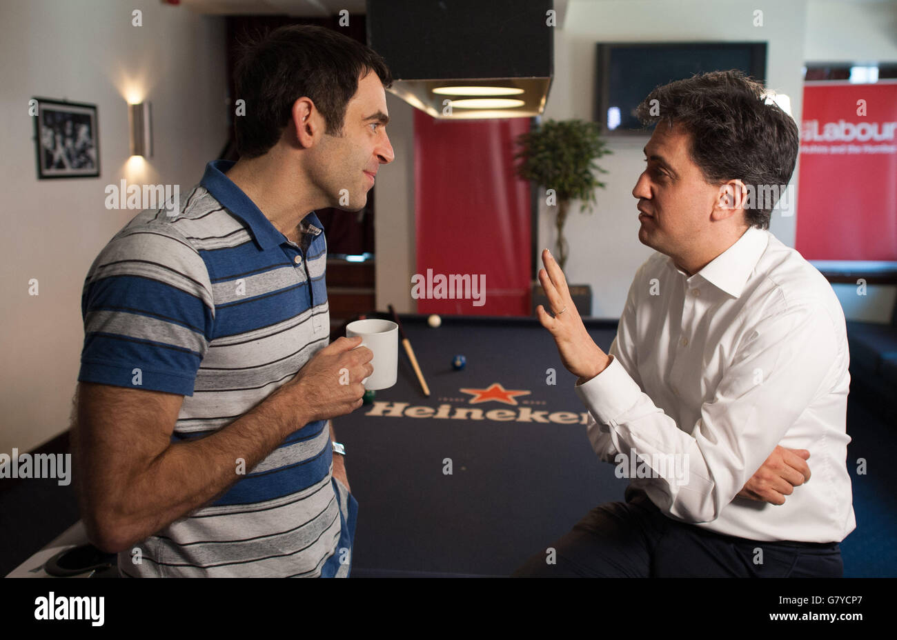 Previously unissued photo dated 23/04/15 of Labour leader Ed Miliband with Snooker player Ronnie O'Sullivan as they played pool at the Common Room Pool hall in Sheffield. Stock Photo
