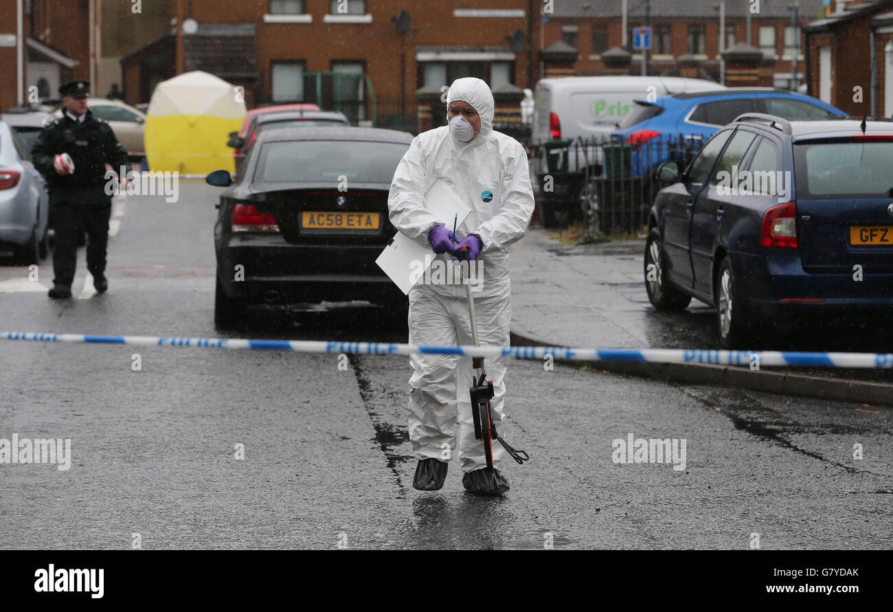 Police and forensic officers in Welsh Street, in the Markets area near Belfast city centre following the fatal shooting of Gerard 'Jock' Davison, a former IRA commander. Stock Photo