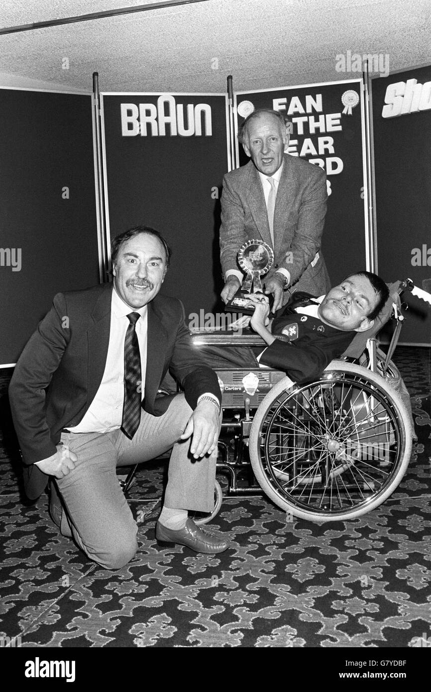 At the Cafe Royal in London, wheelchair-bound Derek Dalton, 35, of Masbro, a Rotherham FC supporter, after he was named Football Fan of the Year. He is alongside TV sports presenter Frank Bough and Jimmy Greaves (l), who was one of the judges. Stock Photo