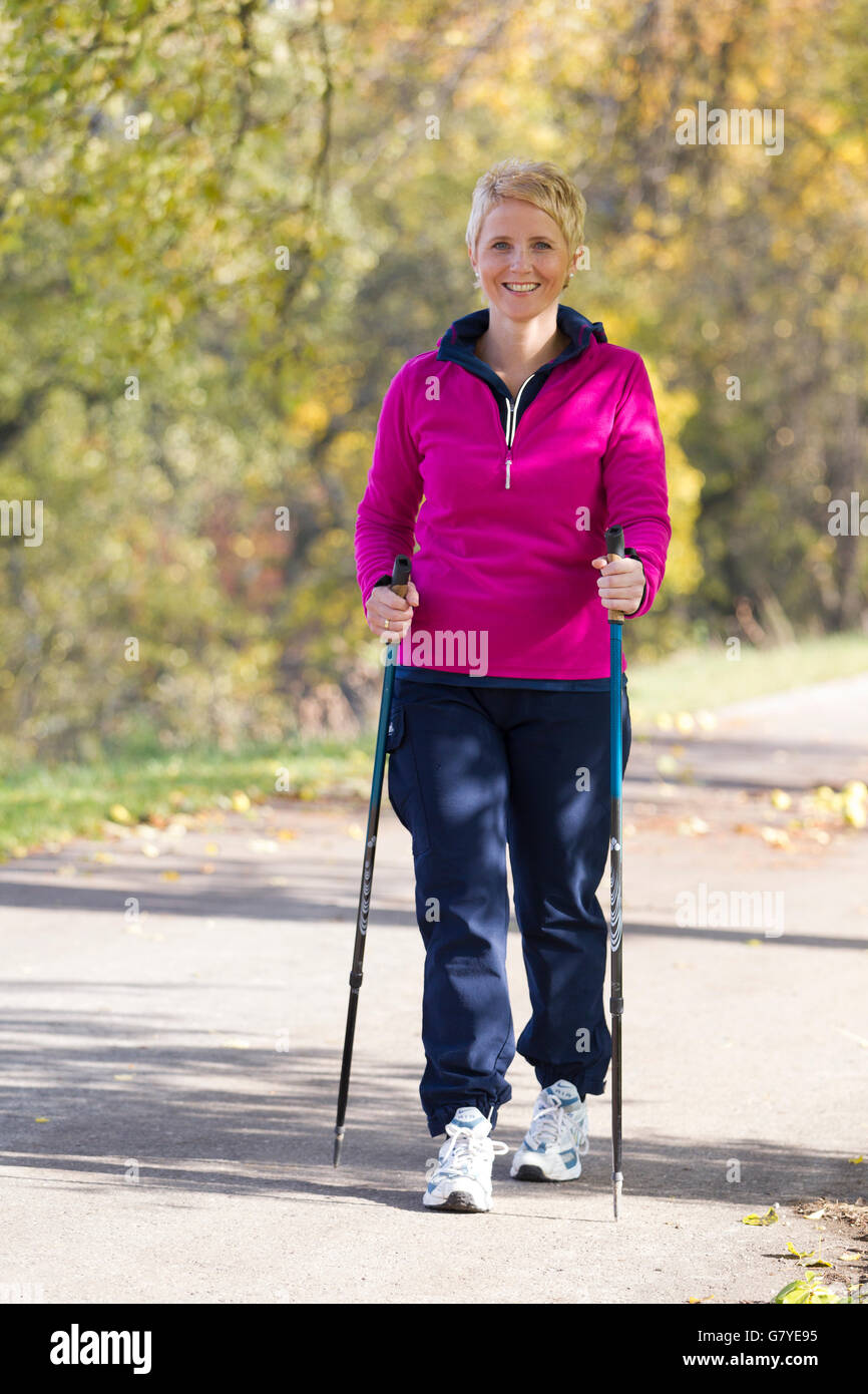 Blonde mature woman nordic walking hi-res stock photography and images ...