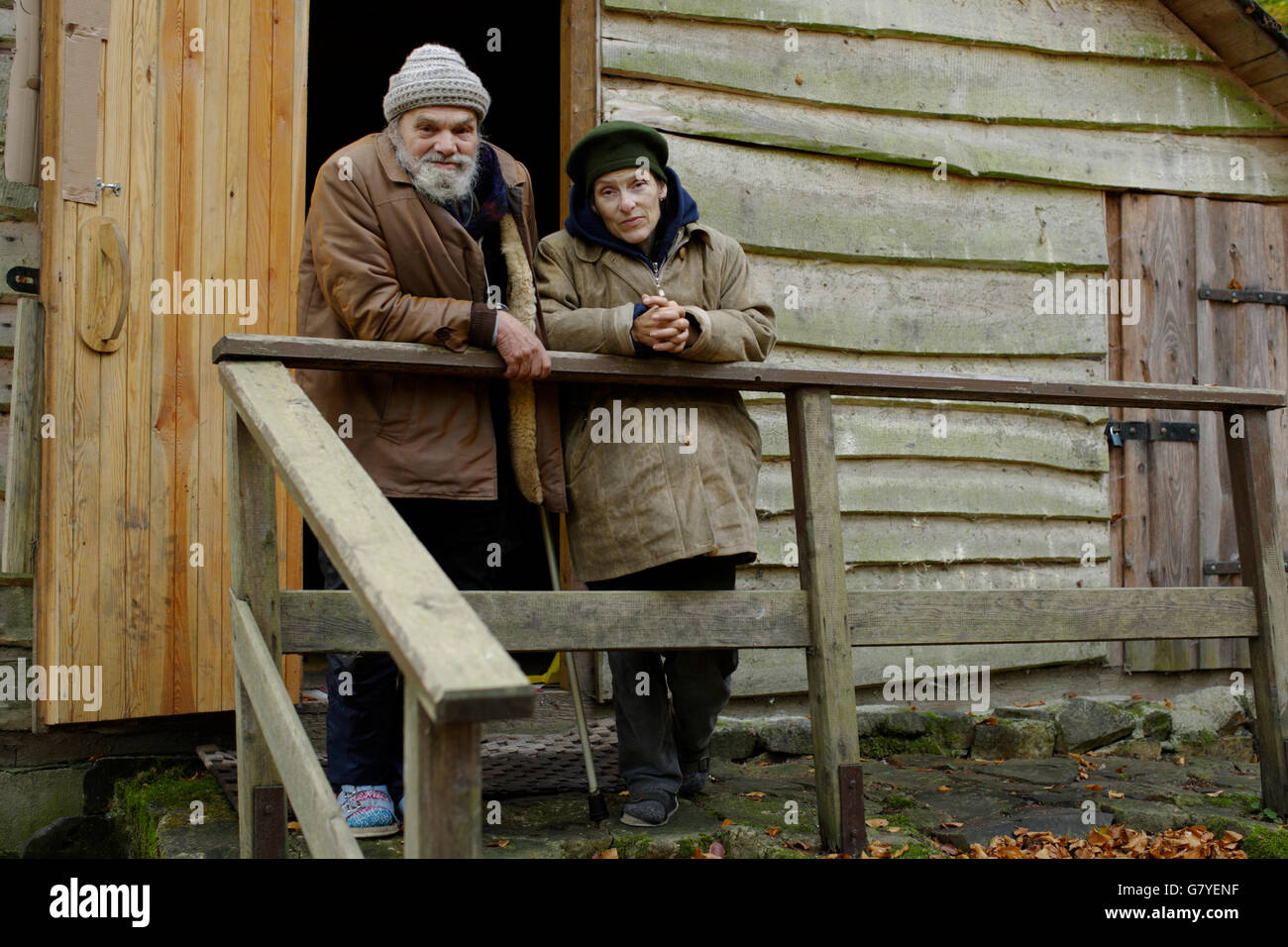 Homeless couple in front of a forest hut, in a wood near Carlsbad, Karlovy Vary, Czech Republic, Europe Stock Photo