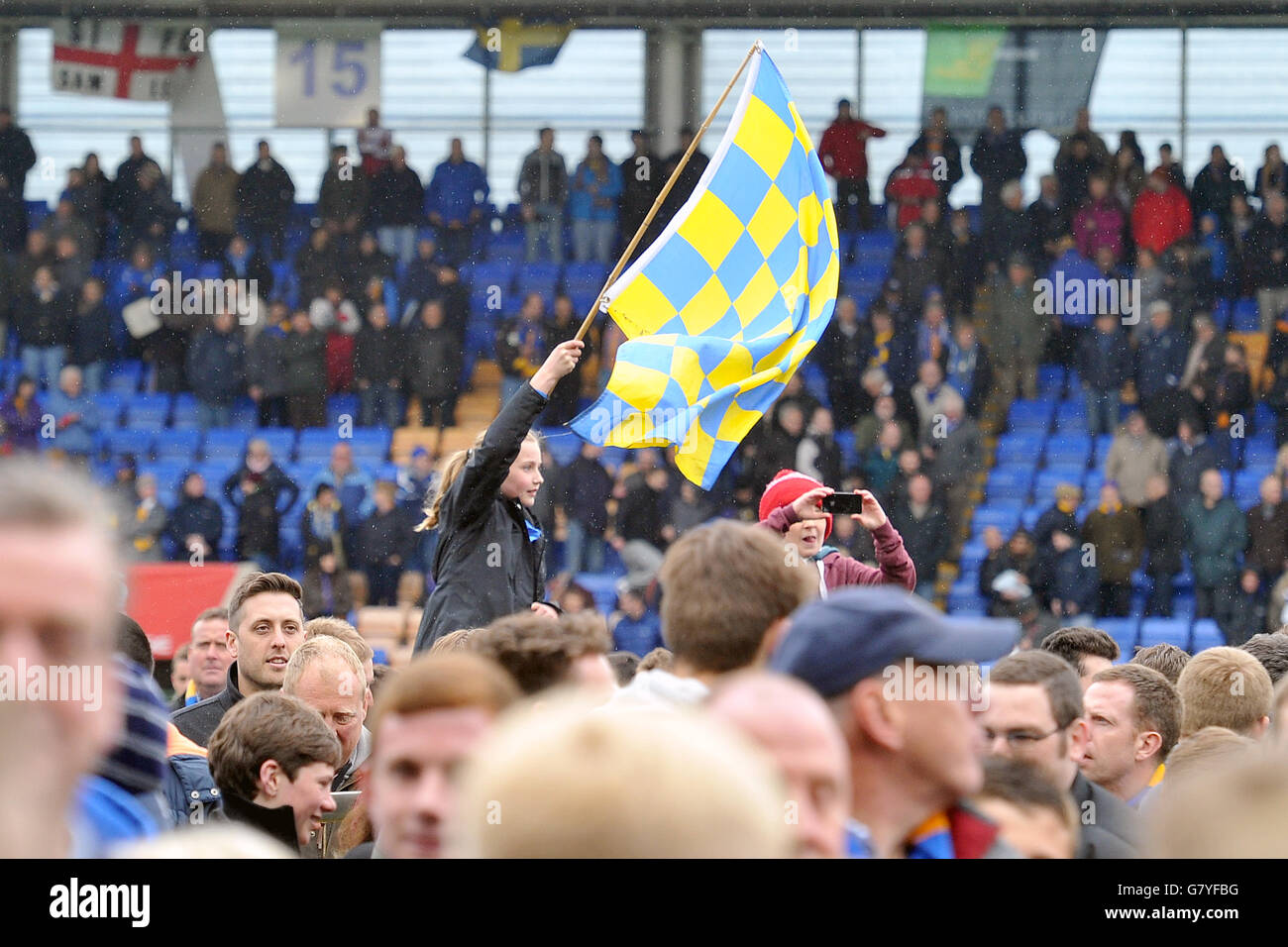 A Shrewsbury Town fan waves a flag to celebrate Shrewsbury Town ...