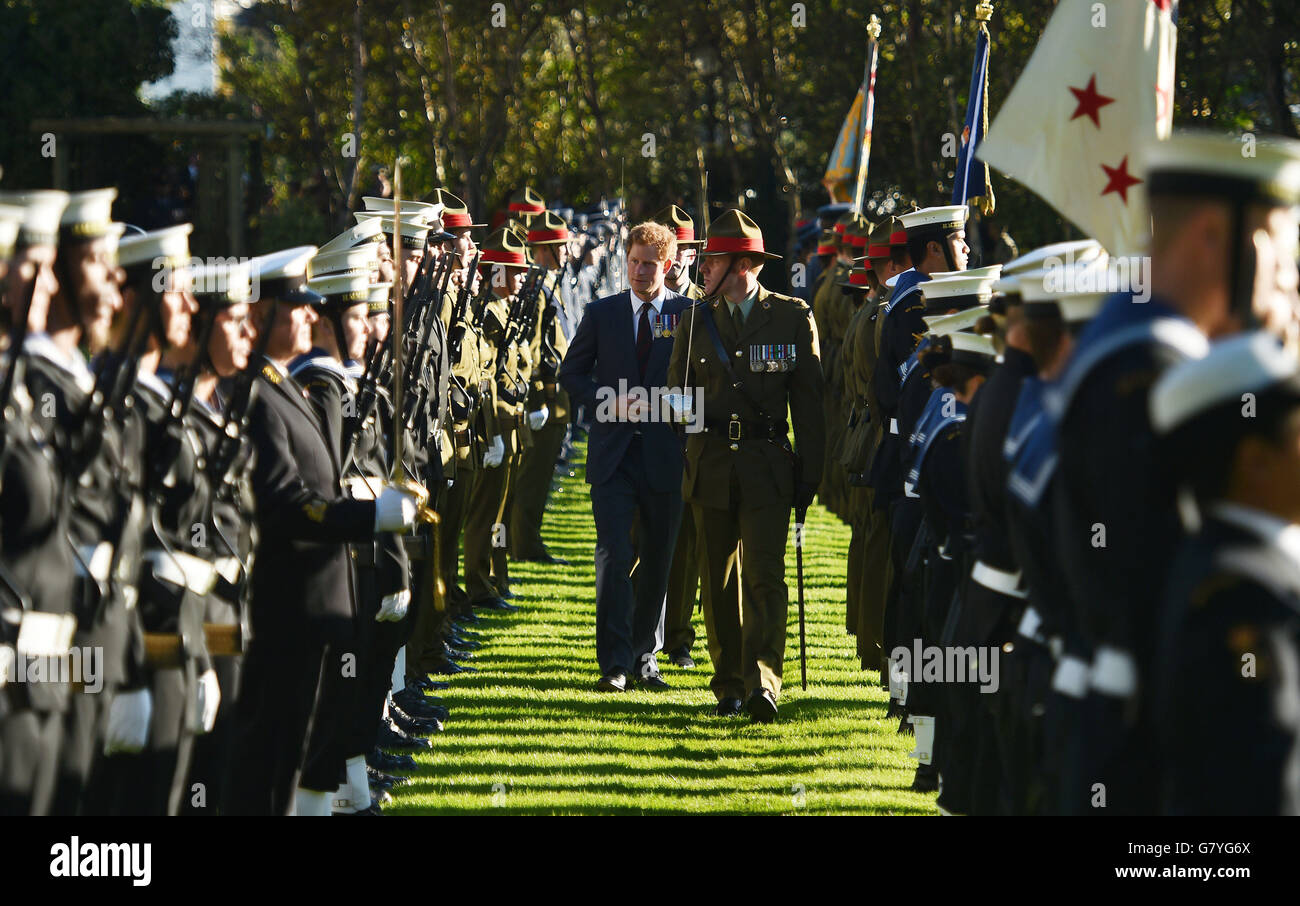 Prince Harry (centre left) inspects the Guard of Honour during a welcome ceremony at Government House, in Wellington during his tour of New Zealand. Stock Photo