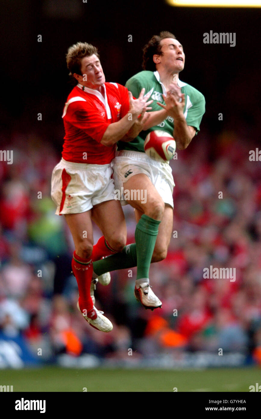 Wales' Shane Williams and Ireland's Girvan Dempesy jump for a high ball