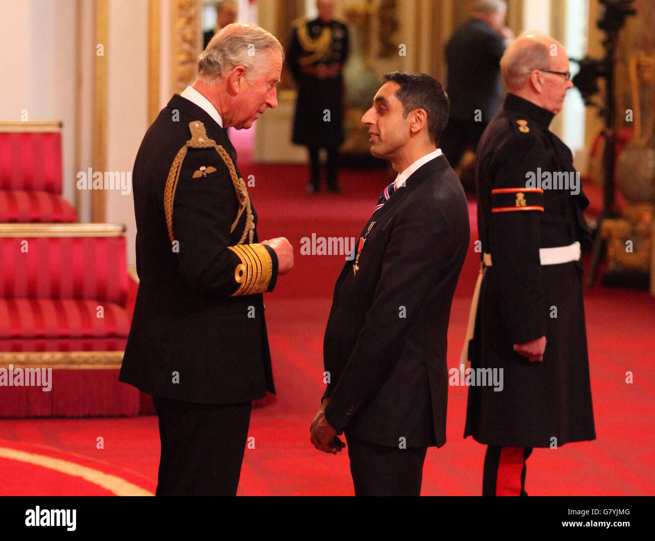Mr Jatinder Sharma from Wolverhampton is made an Officer of the Order of the British Empire (OBE) by the Prince of Wales at an Investiture ceremony at Buckingham Palace, London. Stock Photo