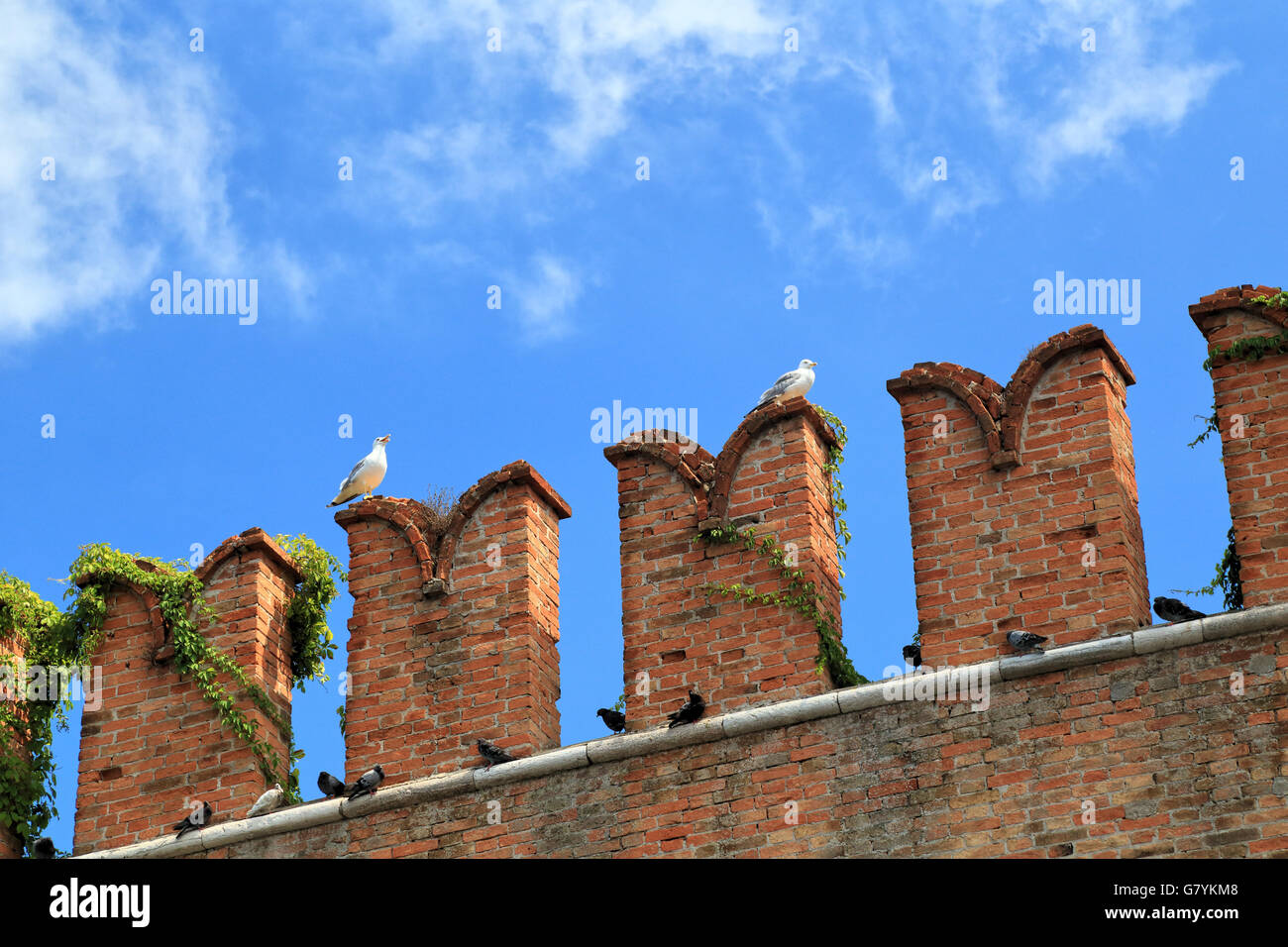 Fortification wall of Arsenale against blue sky, Castello, Venice. battlements Stock Photo