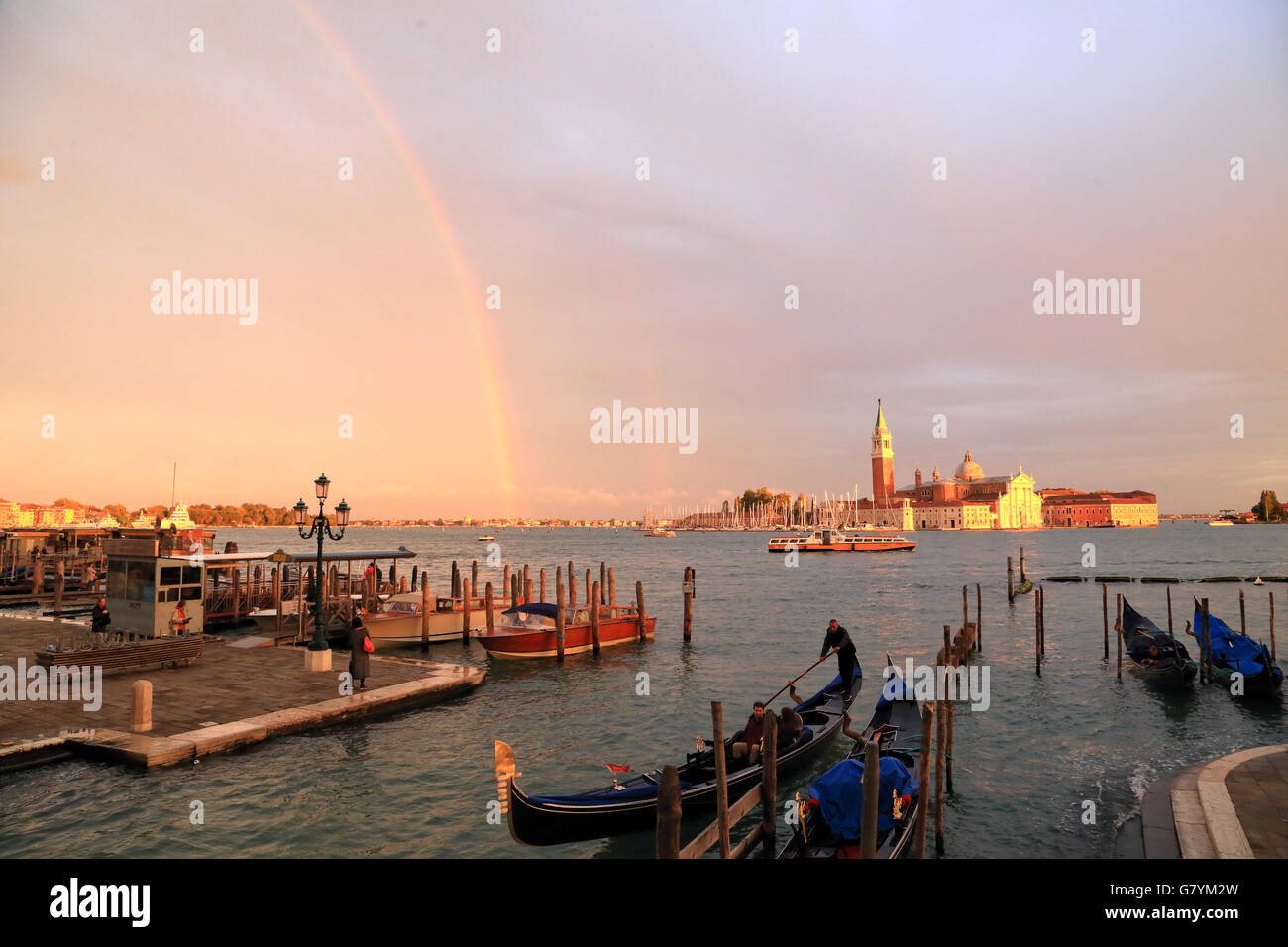 Rainbow at rainy day in Venice, Italy. View to Isola di San Giorgio Maggiore. Stock Photo