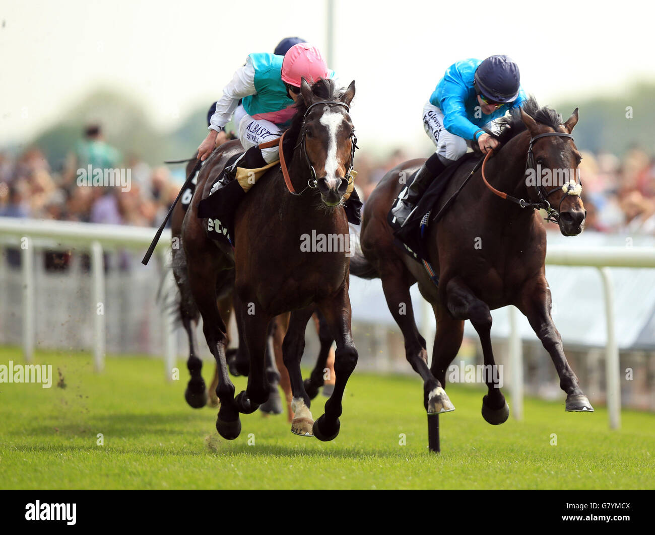 Snow Sky ridden by Ryan Moore (left) beats Brown Panther ridden by Richard Kingscote to win The Betway Yorkshire Cup during day three of the Dante Festival at York Racecourse, York. Stock Photo