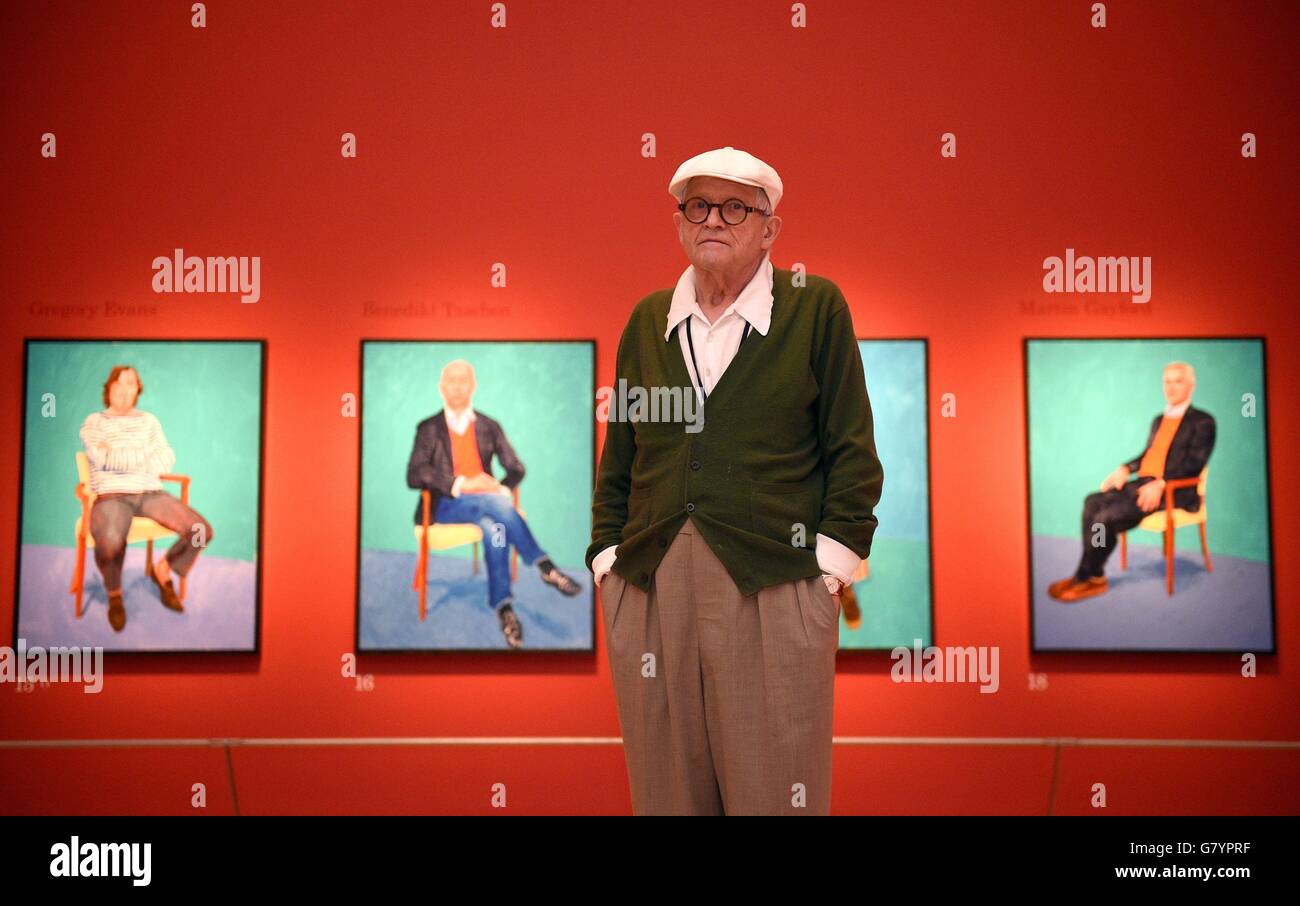 Artist David Hockney poses for photographs in the Sackler Wing at the Royal Academy of Arts, London, where an exhibition of his work entitled 'David Hockney RA: 82 Portraits and 1 Still-life', is on display to the public from July 2nd. Stock Photo