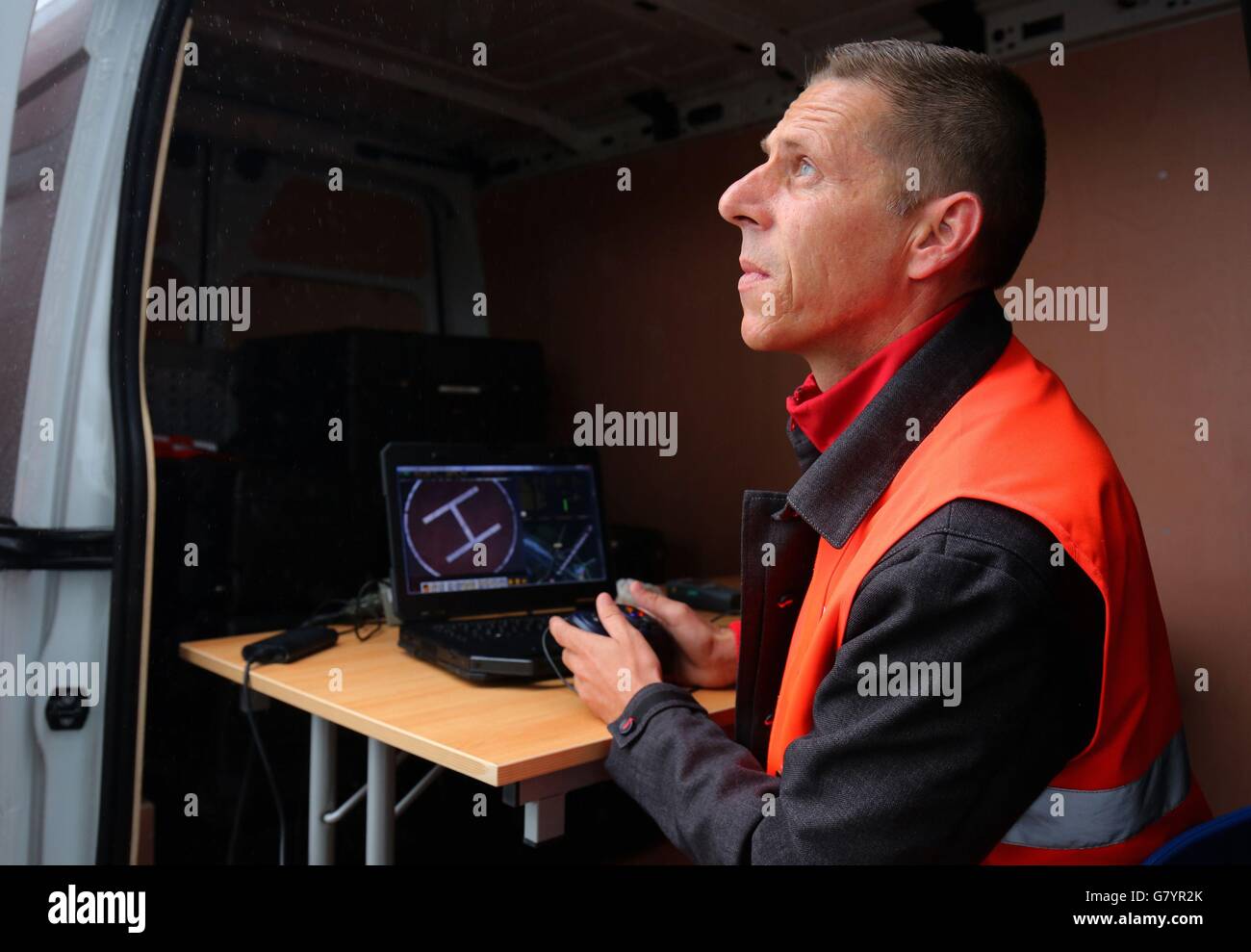 A pilot flies a new security drone from inside a van at Eurotunnel in