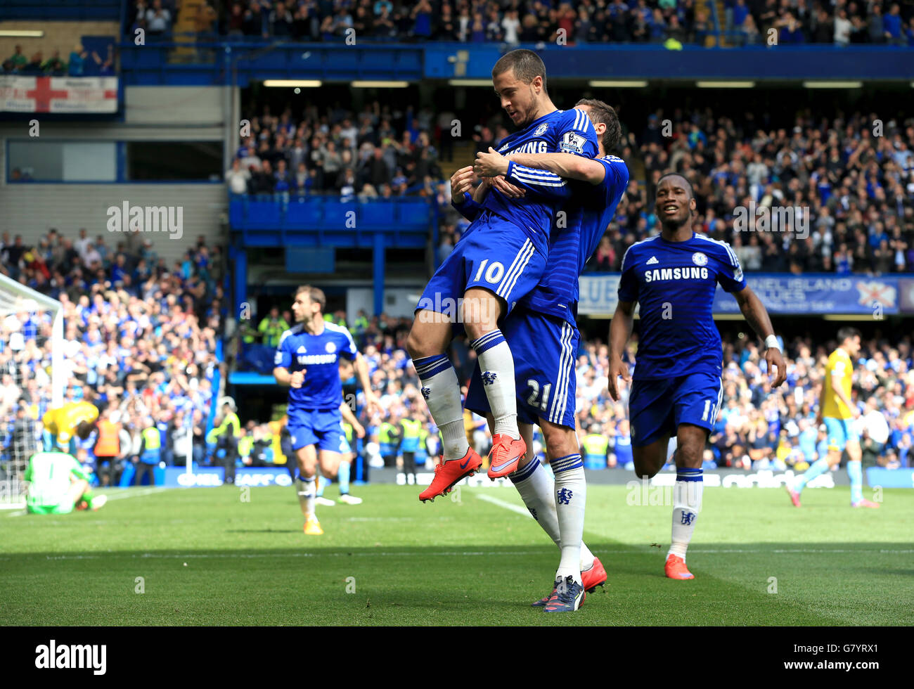 Chelsea's Eden Hazard celebrates with teammates after missing his penalty but scoring with the rebound header during the Barclays Premier League match at Stamford Bridge, London. PRESS ASSOCIATION Photo. Picture date: Sunday May 3, 2015. See PA story SOCCER Chelsea. Photo credit should read: Nick Potts/PA Wire. Stock Photo
