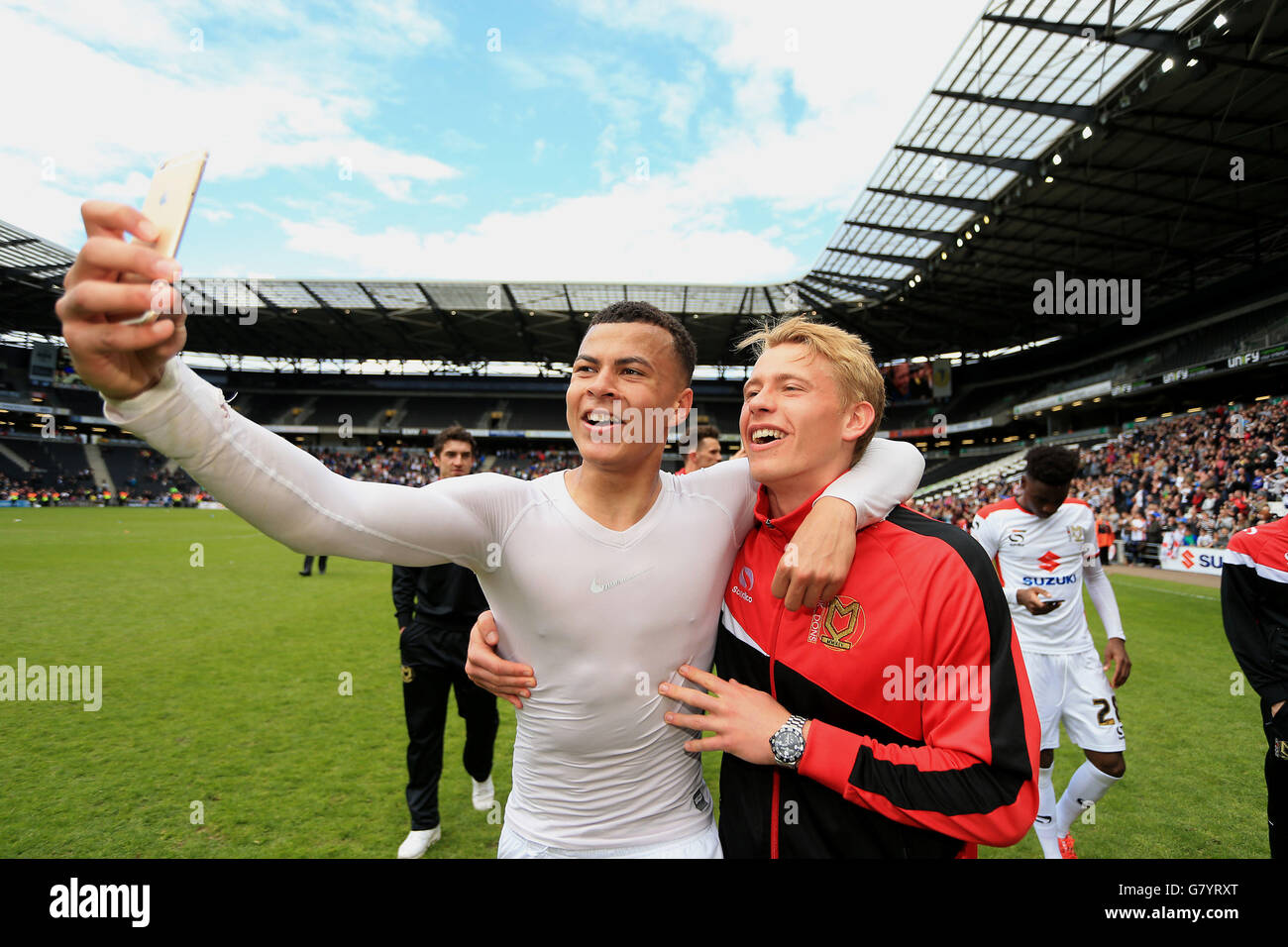 MK Dons' Dele Alli (left) and Tottenham Hotspurs' Tom Carroll