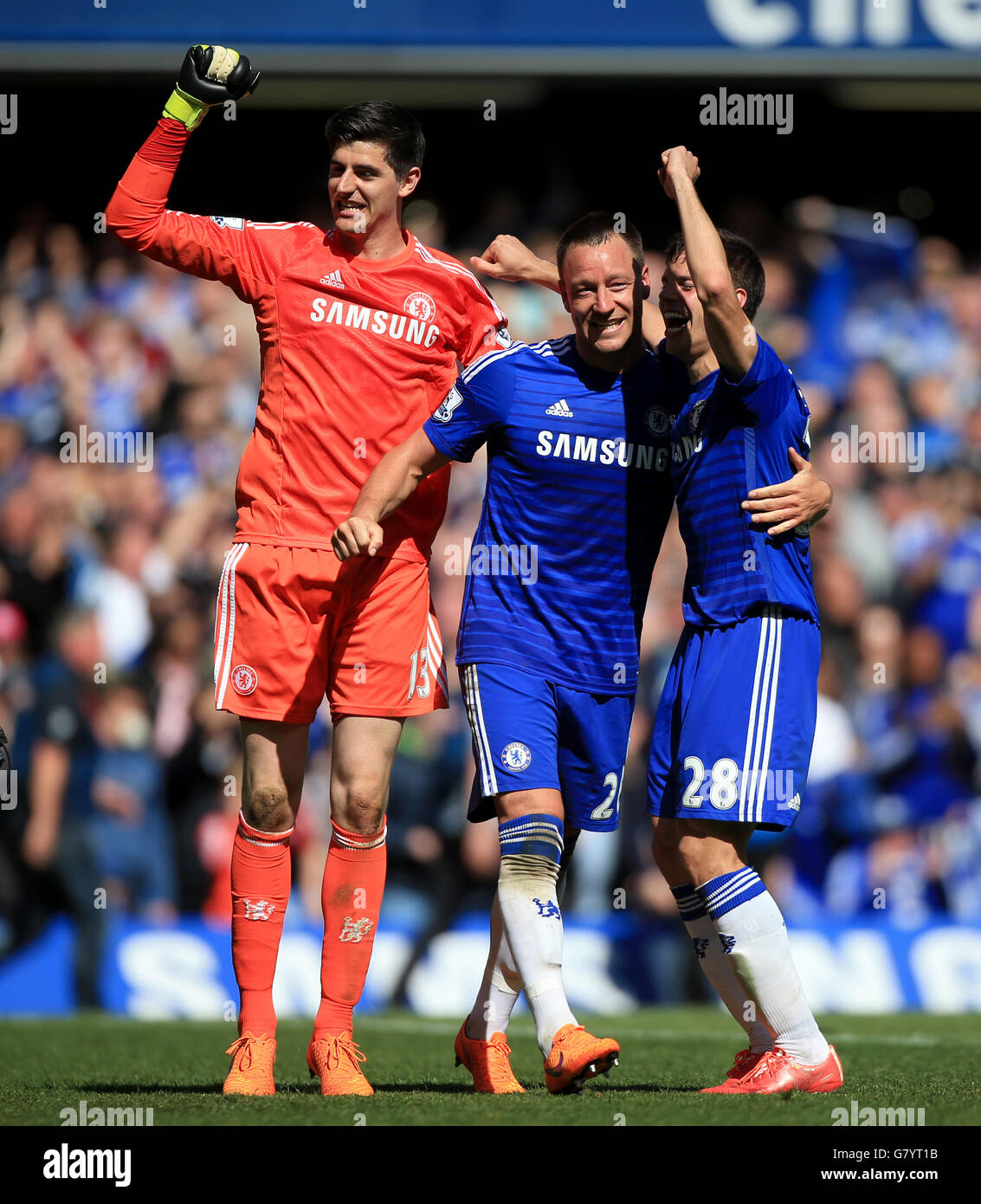 (left to right) Chelsea's Thibaut Courtois, John Terry and Cesar Azpilicueta celebrate winning the title after the Barclays Premier League match at Stamford Bridge, London. PRESS ASSOCIATION Photo. Picture date: Sunday May 3, 2015. See PA story SOCCER Chelsea. Photo credit should read: Nick Potts/PA Wire. RESTRICTIONS: Editorial use only. Maximum 45 images during a match. No video emulation or promotion as 'live'. No use in games, competitions, merchandise, betting or single club/player services. No use with unofficial audio, video, data, fixtures or club/league logos. Stock Photo