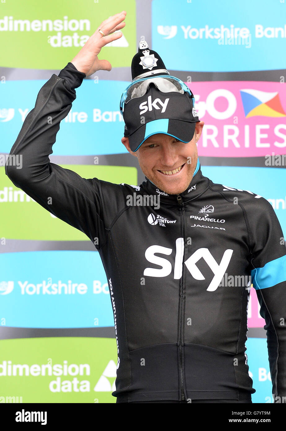 Cycling - Tour de Yorkshire - Stage Three - Wakefield-Leeds. Team Sky Rider Lars-Petter Nordhaug wears a Policeman's helmet trophy after his team won the Team Competition of the Tour de Yorkshire. Stock Photo