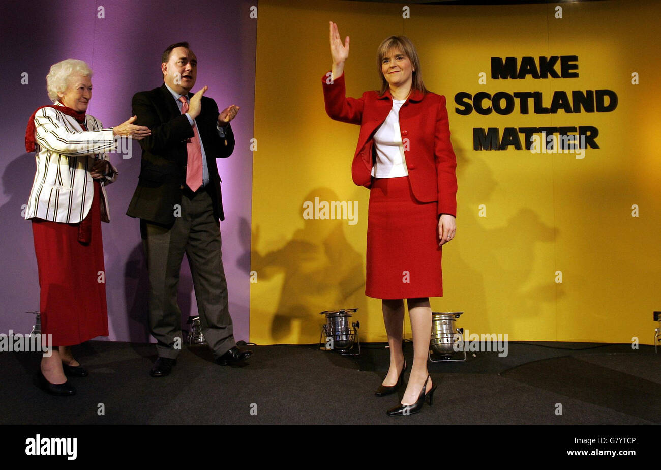 Scottish National Party deputy leader Nicola Sturgeon M.S.P.(right) accepts the plaudits from party Leader Alex Salmond M.P. and party President Winnie Ewing (left) after making her speech. Stock Photo