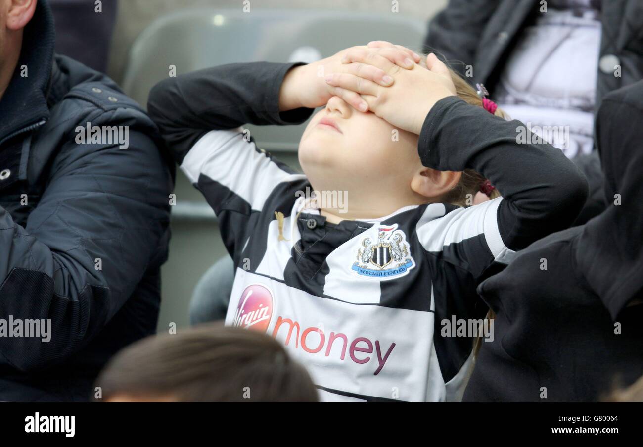 A young Newcastle fan reacts during the Barclays Premier League match at St James' Park, Newcastle. Stock Photo